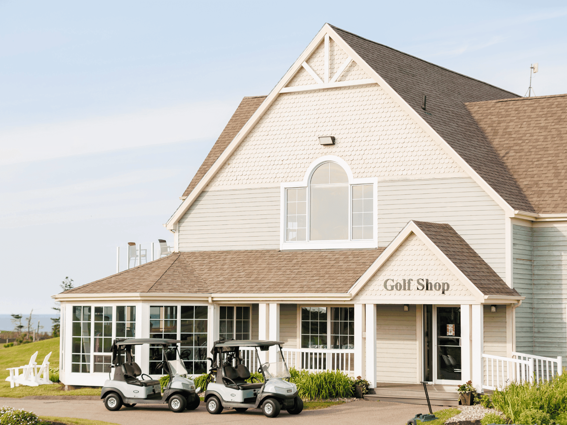 Golf carts parked outside the pro shop at Prince Edward Island golf resorts stand out at Rodd Crowbush Golf & Beach Resort