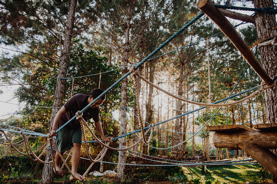 a man going through a rope maze