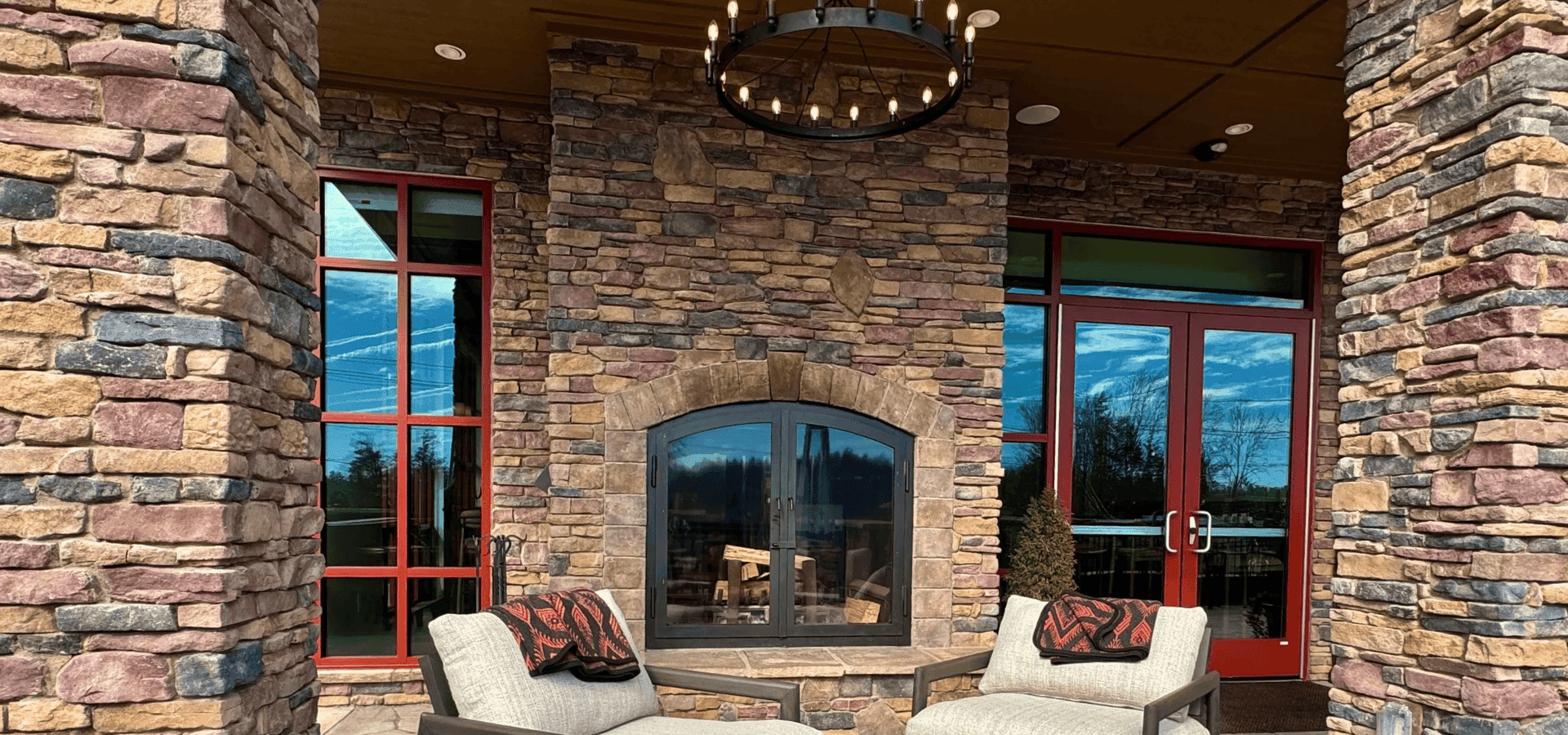 Outdoor fireplace and terrace seating at The Embers Hotel