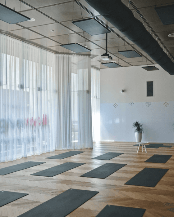 Yoga mats arranged in the spacious room at Nesuto Mounts Bay