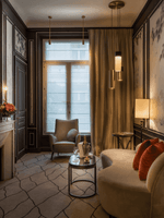 TV lounge with plush sofa near window in Deluxe Suite Parisienne at Hotel Westminster Paris
