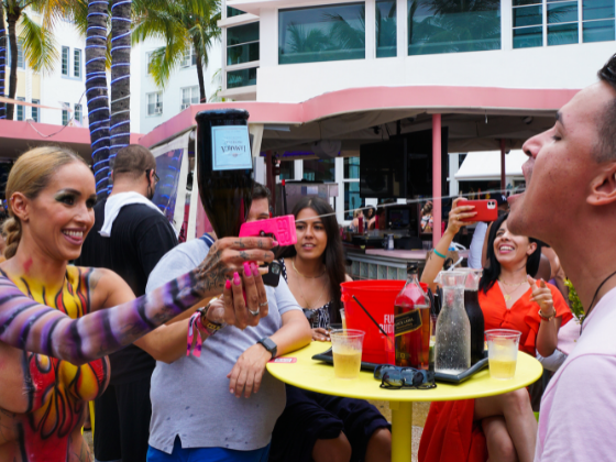 People enjoying with beverage at Clevelander South Beach