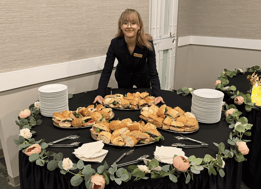Staff member serving gourmet sandwiches for a meeting at Rodd Grand Yarmouth, one of the best hotels in Yarmouth