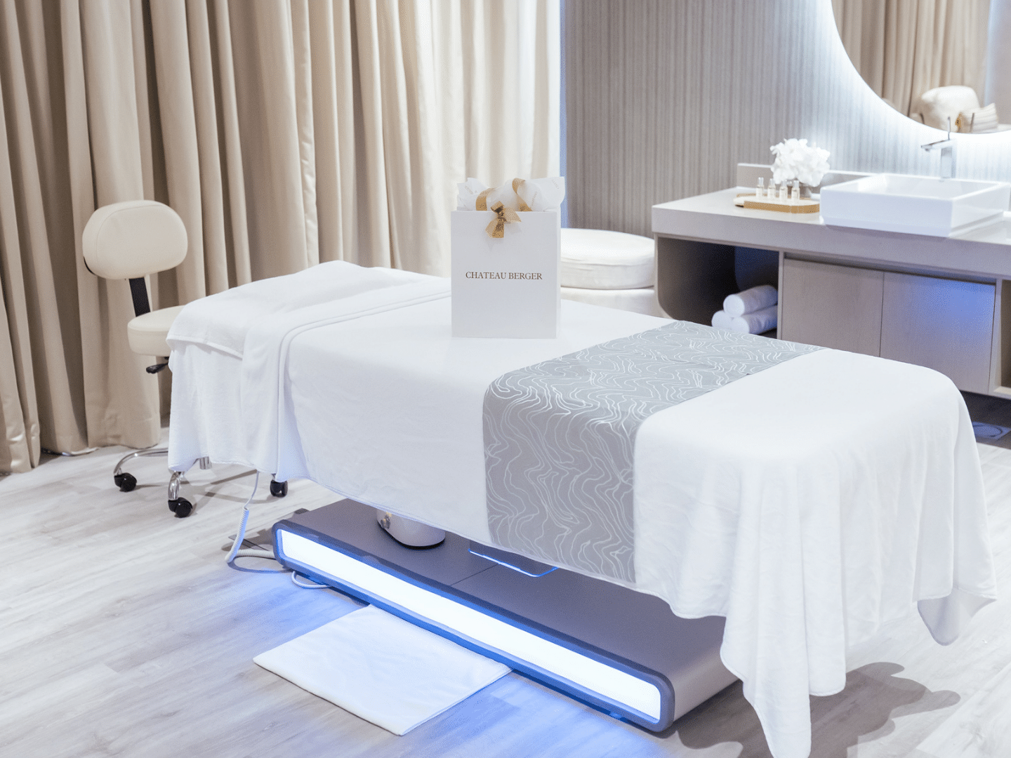 Spa bed, sink, and spa amenities in Pause Spa Château Berger at Paramount Hotel Midtown