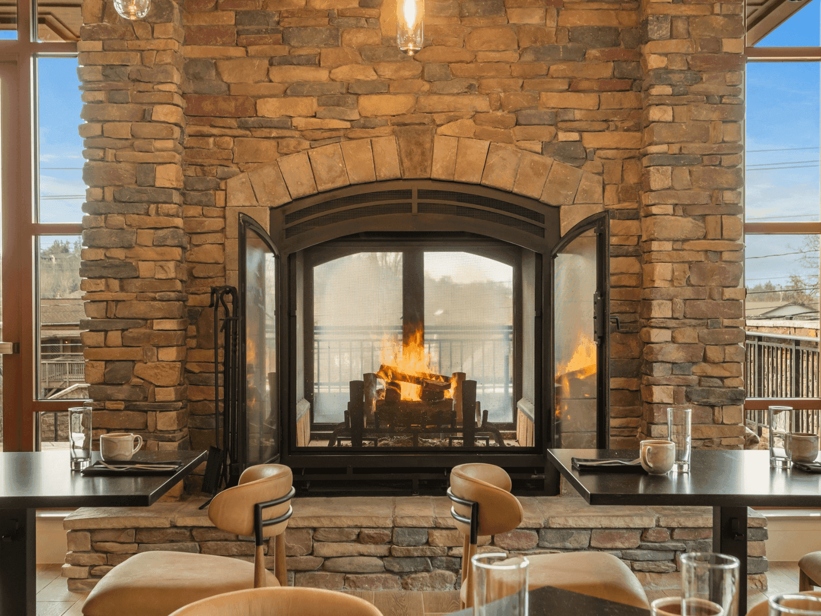 Warm up with our Winter Warm Up Aprés Ski offer, featuring a cozy fireplace and inviting seating area.