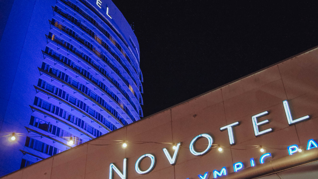 Exterior view of Novotel Sydney Olympic Park at night