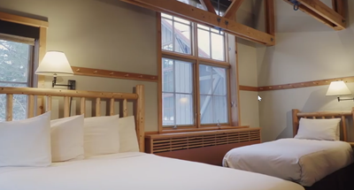 Interior of the loft room with 1 king bed at Sleeping Lady