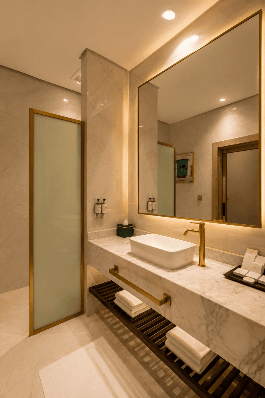 Modern marble vanity with white vessel sink with mirror in Deluxe skyline view at Naviti by Warwick Jeddah 