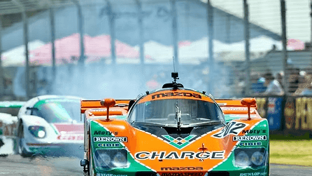 Two race cars compete at the Adelaide Motorsport Festival.