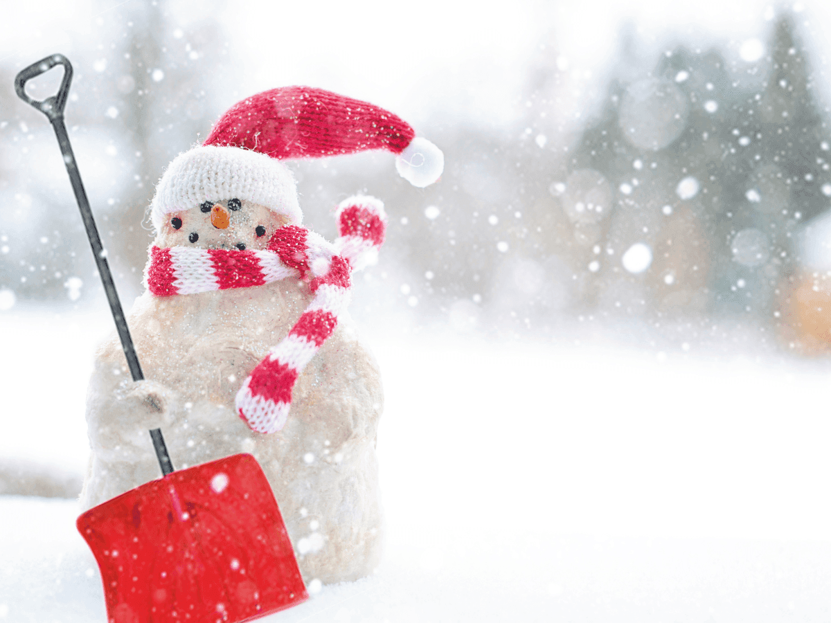 Close-up of a snowman crochet on snow at Blackcomb Springs Suites