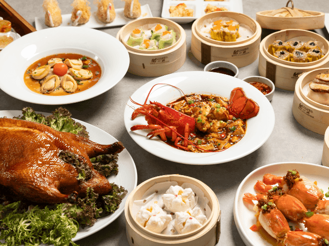 A table filled with a chinese dim sum of delicious dishes.