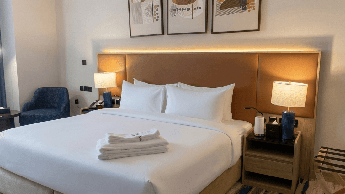 Accessible Room King with white linens, wooden headboard, and modern decor at Warwick Hotel & Spa - Jeddah