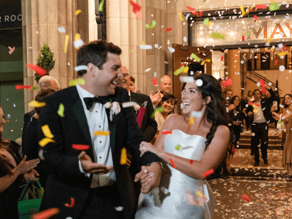 Wedded couple exiting their reception at The Mayo Hotel