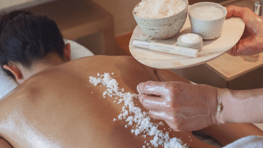 Woman receiving a Mother's Day Celebrations massage with sea salt and essential oils.
