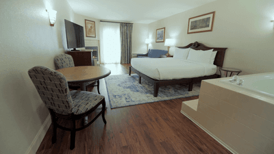Music Road Resort room with a premier king bed and a private jacuzzi, located in Pigeon Forge, Tennessee.