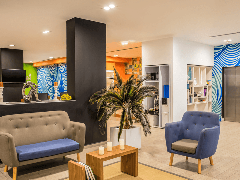 Lobby area with a comfy sofa at One Hotels