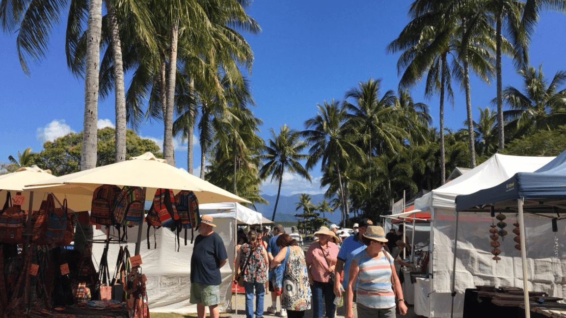 Port Douglas Markets with tents and people browsing near Pullman Port Douglas Sea Temple Resort & Spa