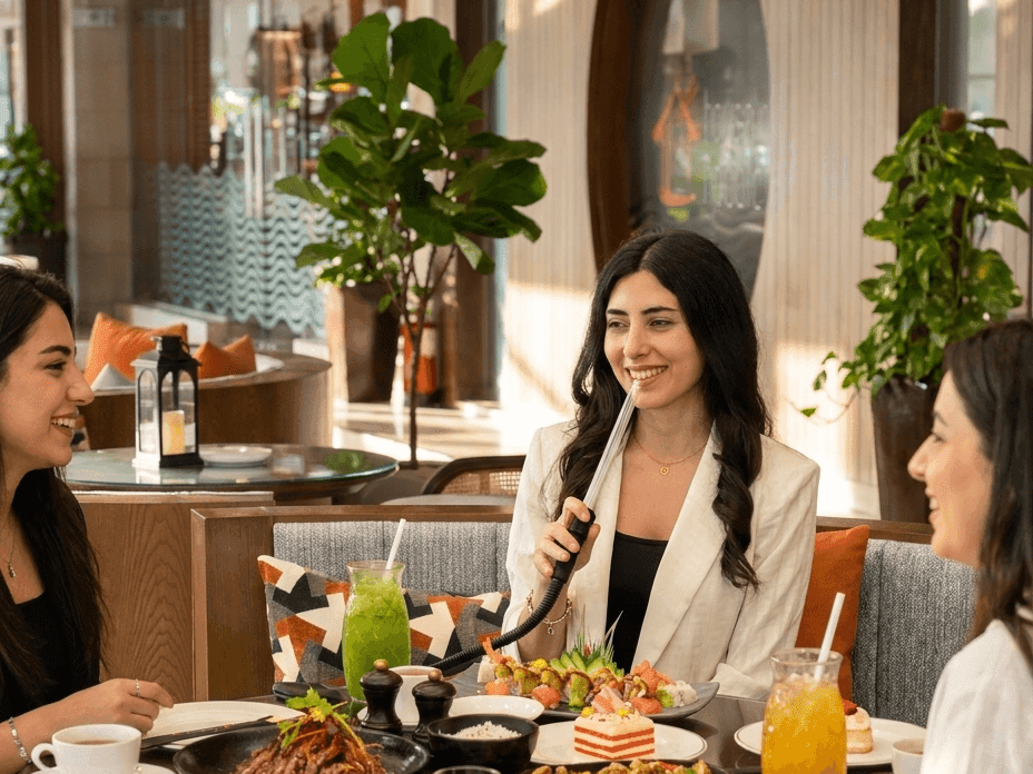 Women enjoying ladies night with drinks and shisha at La Veranda 