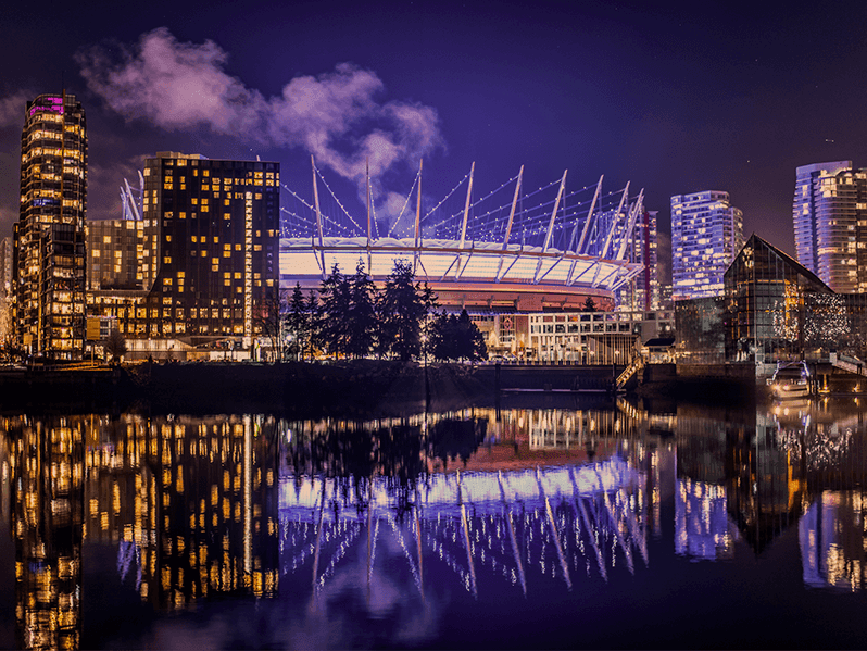 BC Place Stadium at night with a purple glow