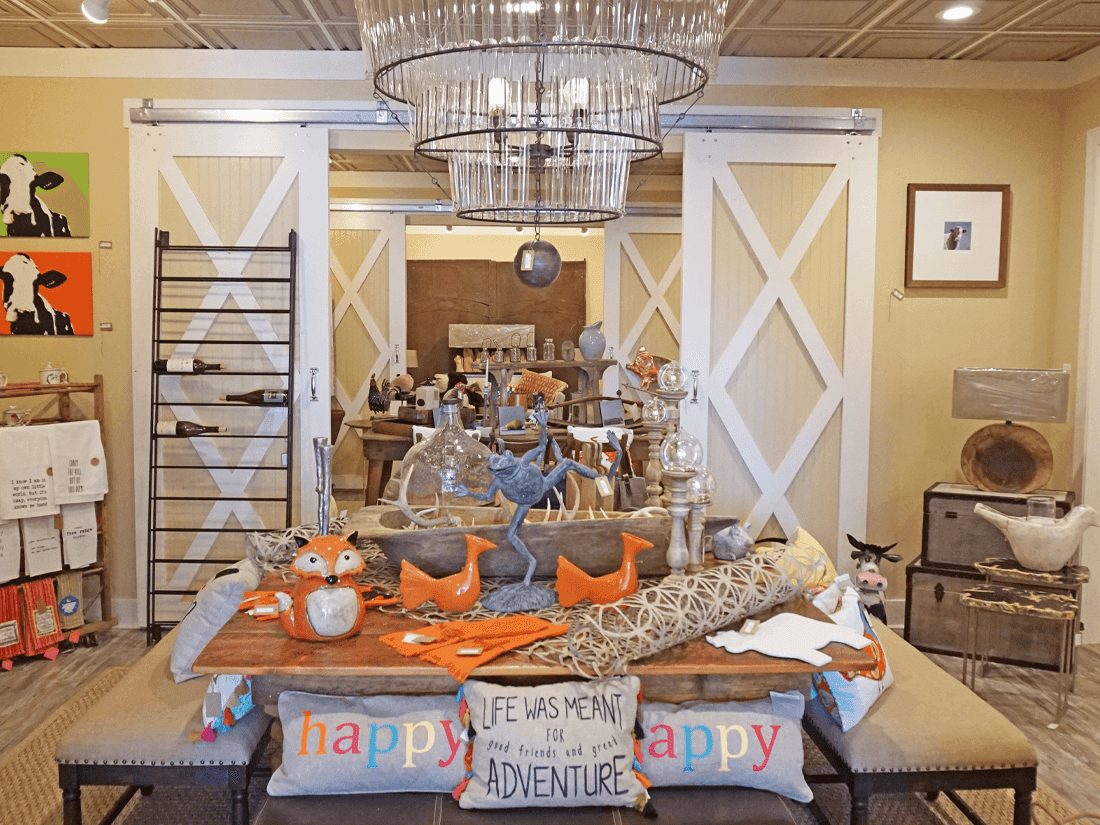 Interior of store with rustic tables and home items at Inn at Willow Grove