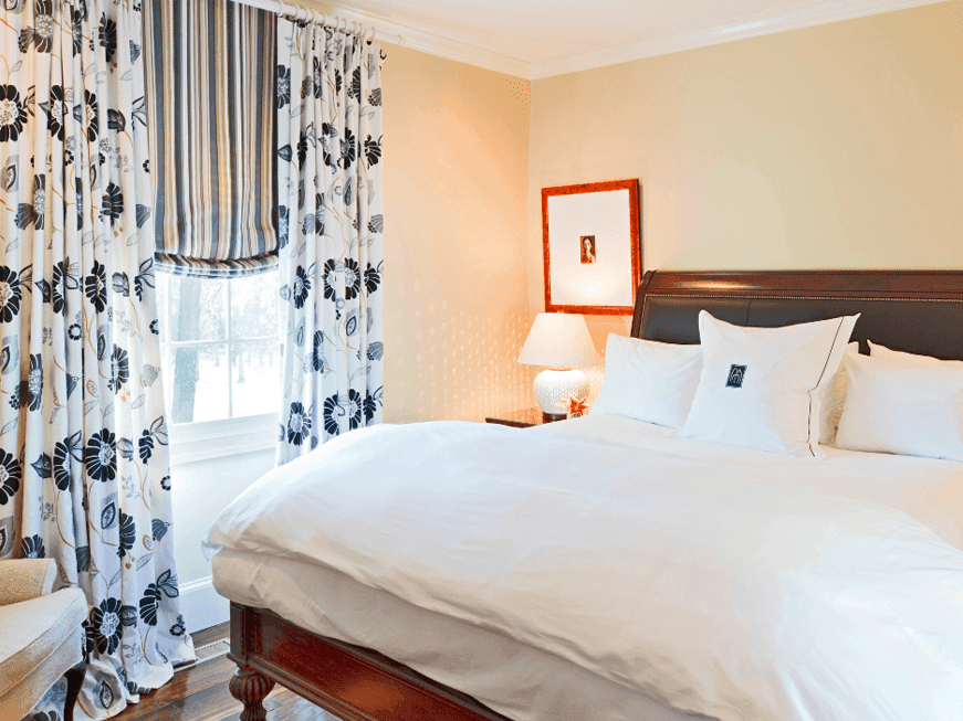 The Butler's Cottage room with a cozy bed and lamp Inn at Willow Grove, hotels in virginia