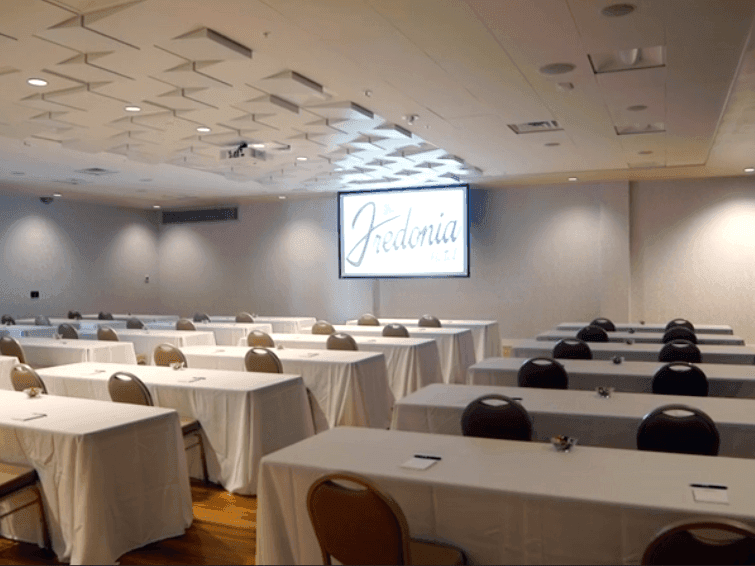 rows of chairs and tables in a large room