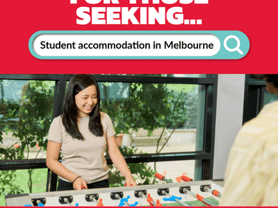 Resident playing table football at Student Living - 800 Swanston.