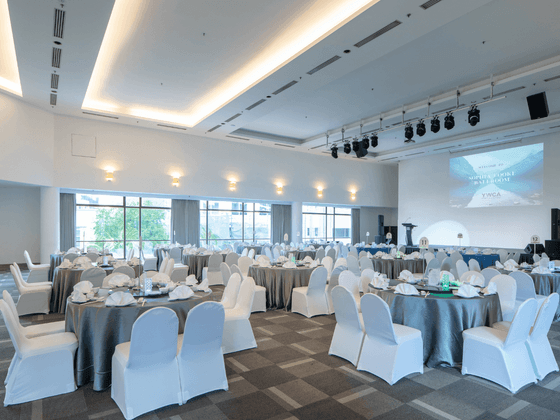 Peace Room featuring setup banquets under glowing lights by windows at YWCA Fort Canning Lodge
