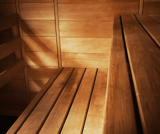 Wooden sauna interior with bench seating at Anchorage By The Sea