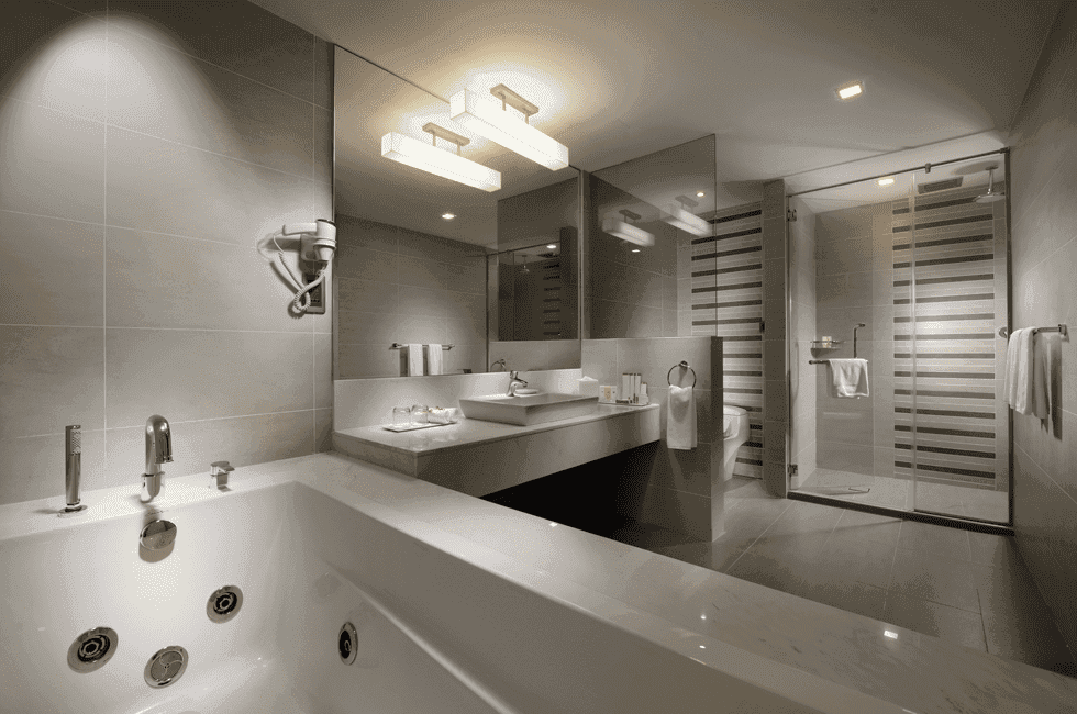 Bathroom with bathtub and vanity in Premier Suite at Sunway Hotel Georgetown