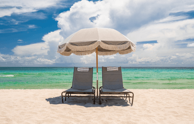 2 sunbeds & an umbrella on the beach near Boulan South Beach