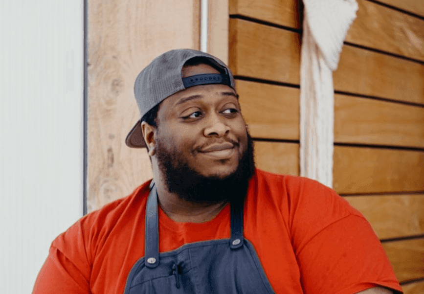 Chef Jacob's posing for a picture at Kinship Landing