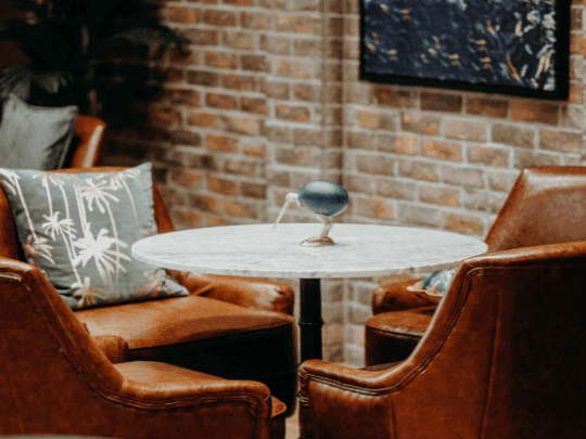 A round dining table arranged in Melrose Bar and Louge at Paramount Hotel Midtown