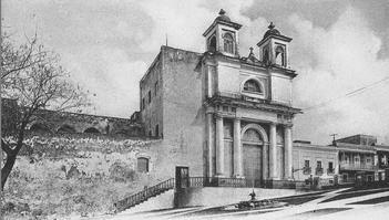 Black and white image of an old church with two bell towers and a grand entrance.