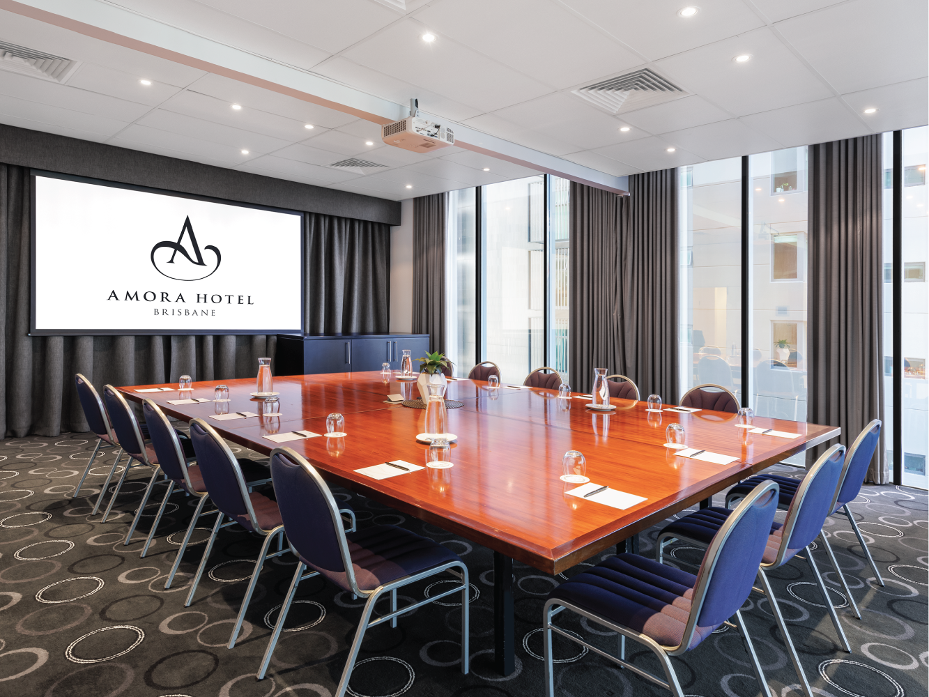 Well arranged meeting setup in Dobson Room at Amora Hotel