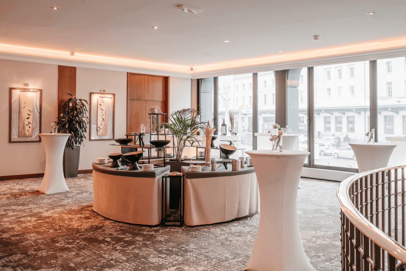 Elegant drink setups, and large windows with a city view in Foyer Mezzanine at Warwick Geneva