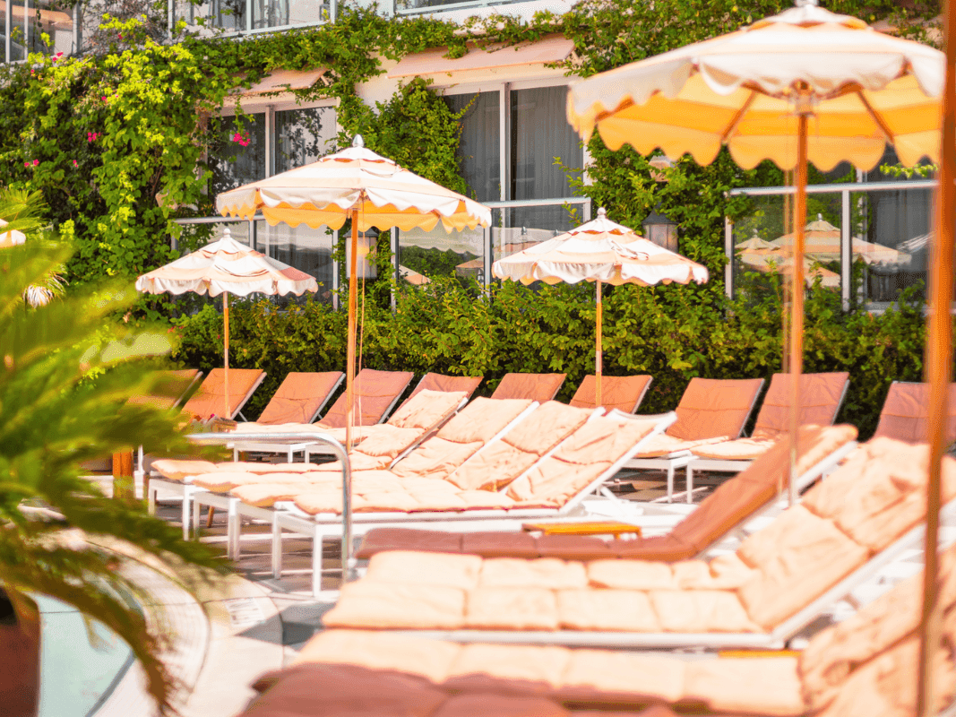 Outdoor pool area with pool beds at Plymouth South Beach Hotel