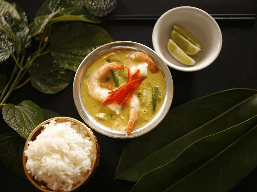 A meal with rice, prawns curry & lemon pieces at Amora Hotel
