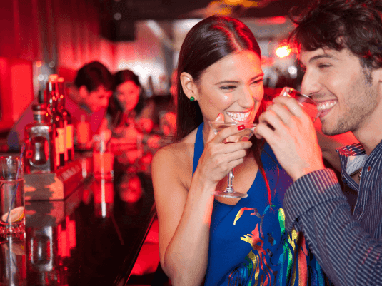 A couple having drinks in a bar at Hotel Plaza San Francisco