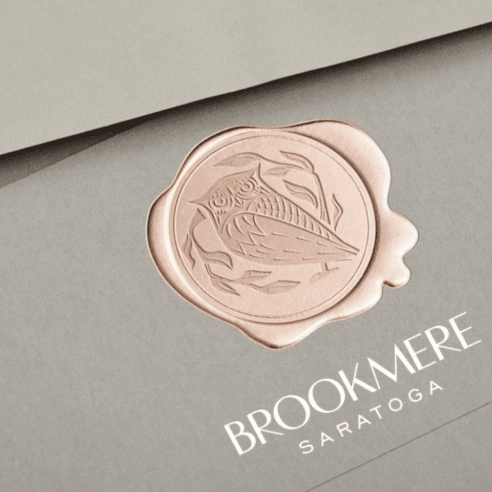 Logo of Broome Saratoga featuring an owl used at Hotel Brookmere