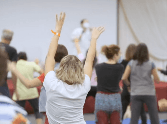 People at an indoor wellness session at Honor’s Haven Retreat