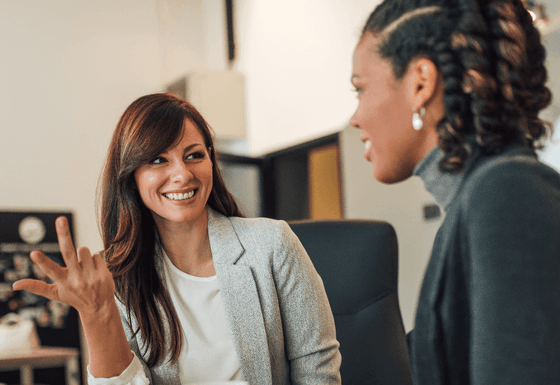 Two women talking to each other at Honor’s Haven retreat