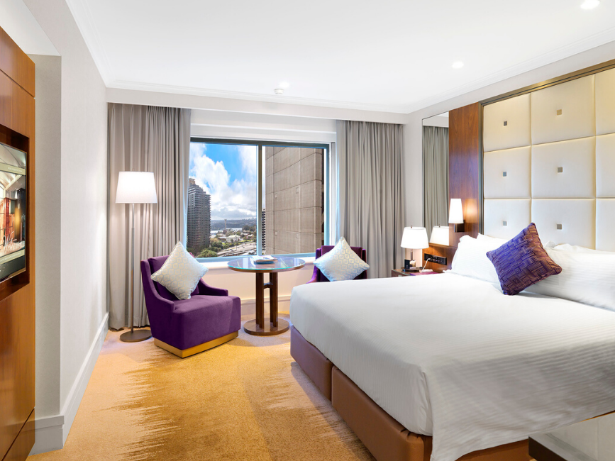 Deluxe King Room with city view window at Amora Hotel Sydney