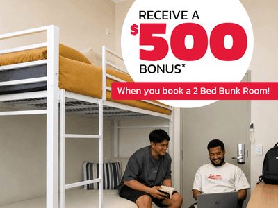 Two students relaxing in a modern bunk bed room with promotional offer displayed at UniLodge Herston