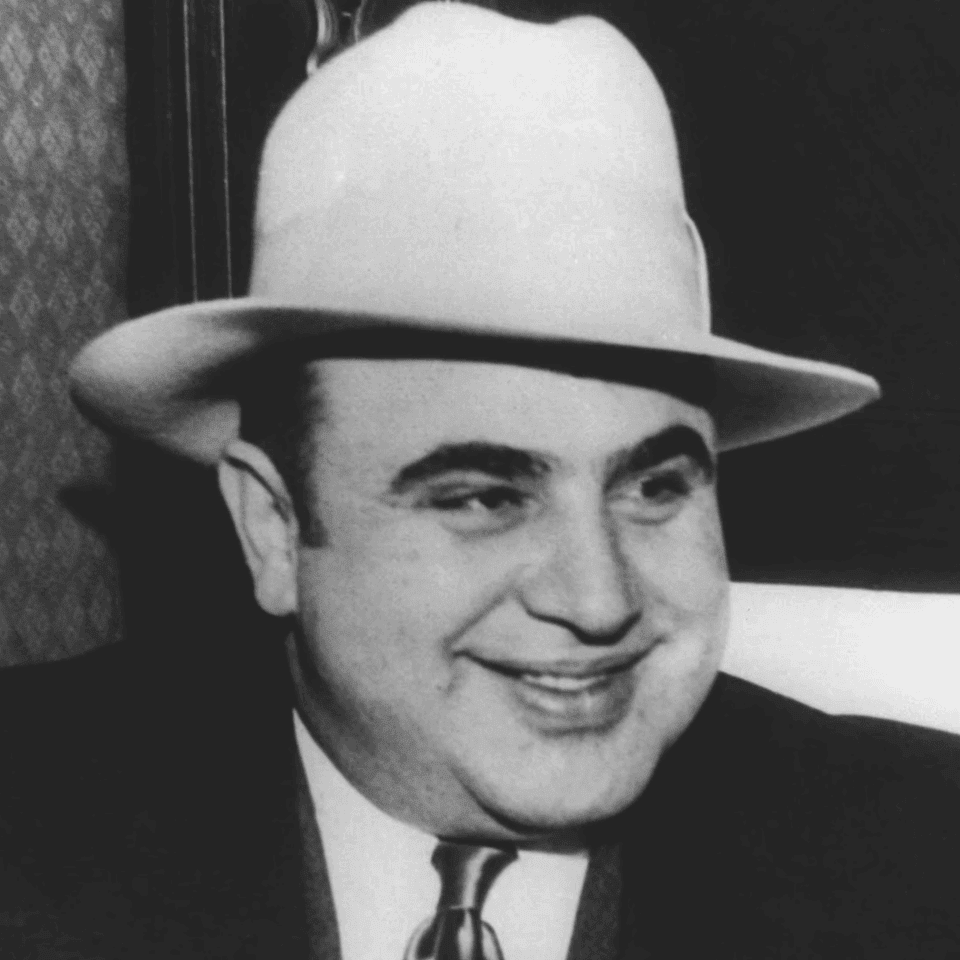 Black and white portrait of American gangster Al Capone in a fedora and formal suit near Arlington Resort Hotel & Spa