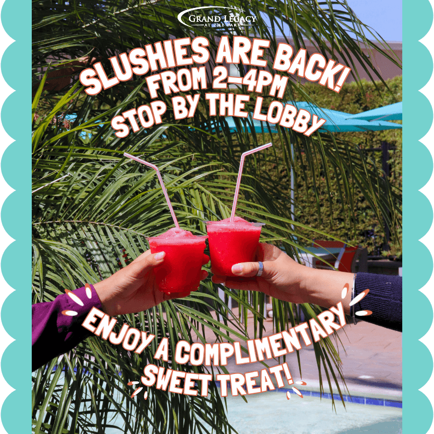 Two hands holding bright red slushies with pink straws in front of palm trees and a poolside setting.