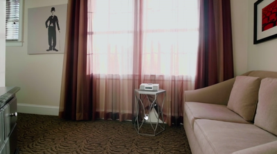 Living area in Deluxe Queen Room at Artmore Hotel
