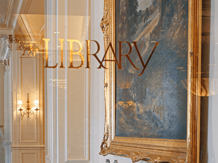 Entrance sign of The Library Bar at Warwick Melrose Dallas