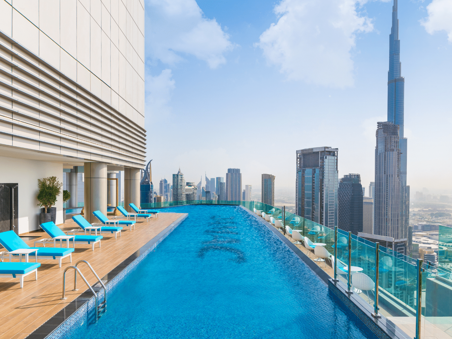 Sun loungers by the pool with city view in Malibu Sky Lounge & Bar at Paramount Hotel Midtown