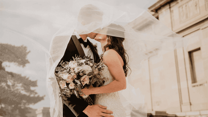 Wedded couple posing intimately outdoors at Sunway Hotel Hanoi